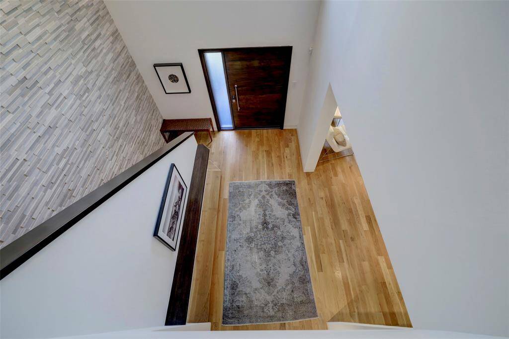 Another dramatic view!  The staircase in the Entry lead up to the second floor offering 2 Bedrooms with ensuite Baths and the Laundry Room.