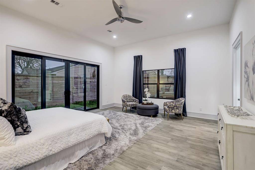 Large primary bedroom with sitting area.