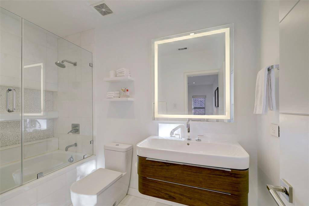 This elegant ensuite Bathroom offers a tub/shower combo.