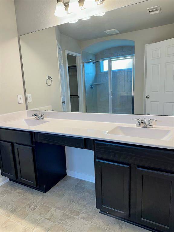 Dual Vanities with plenty of counter space.