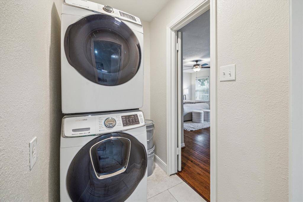 You’ll find convenient access to a utility area with room for stacking washer and dryer, located just off the primary suite.