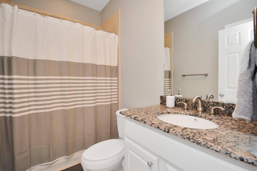 2nd bath with updated plumbing fixture, granite counter top
