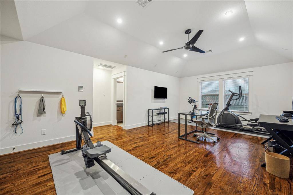 Game/ Media Room/ Bedroom #4: Wonderful highlights include custom juice bar with SS mini fridge, superior craftsmanship soaring ceilings, art lighting, Eastern exposure, and easy access to walk-in attic.