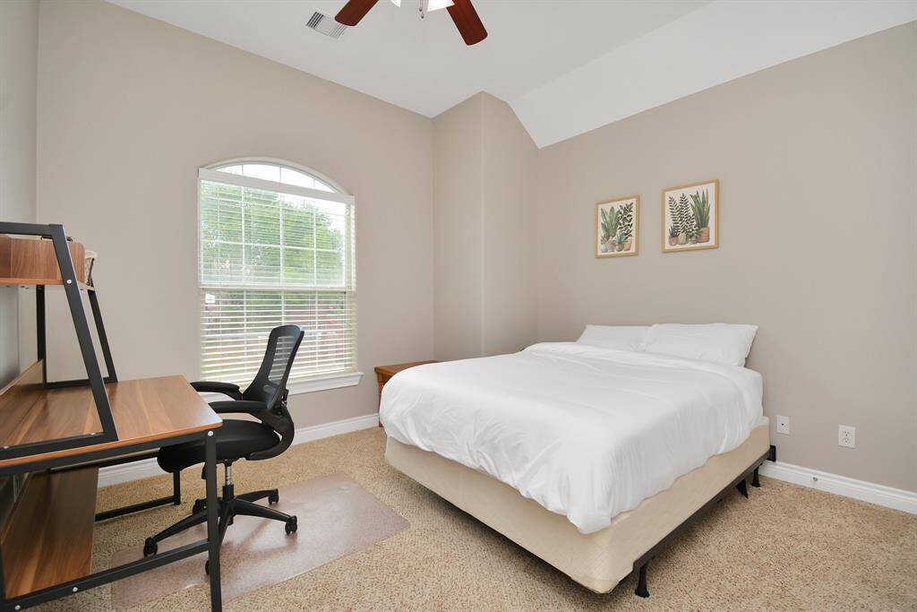 spacious 3rd bedroom can comfortable fit a queen bed and a workstation