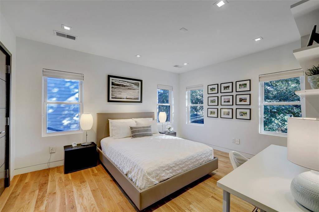 Both Bedrooms upstairs have pretty views of the Live Oak canopy and are large enough to hold a king-size bed.