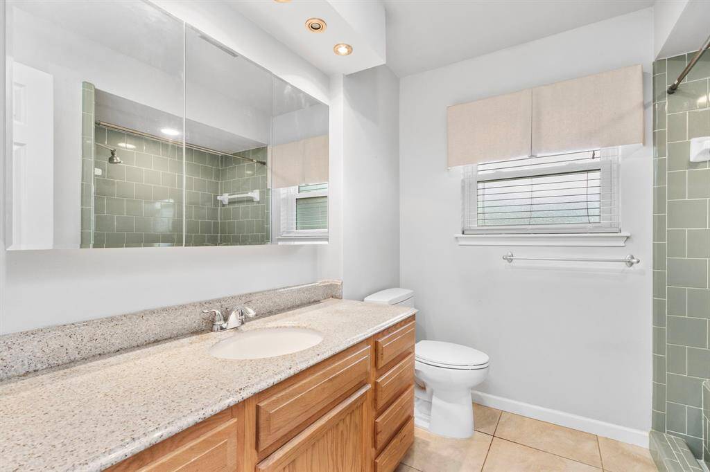 Second full bath, has walk in shower with bench seat.