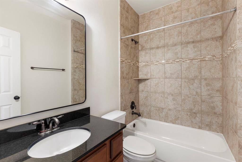 Second full bathroom downstairs just outside of the study/6th bedroom down.