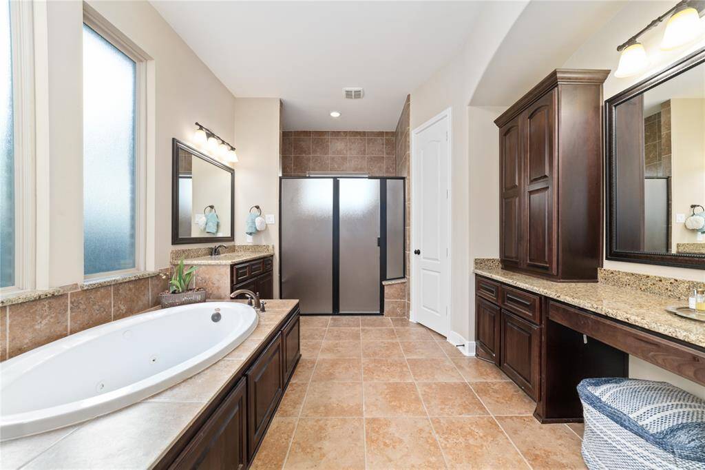 Primary bathroom suite with elongated tub