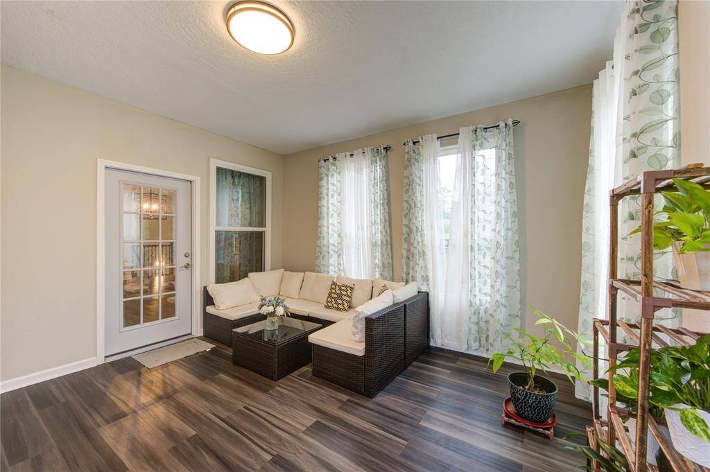 Situated on the second/main floor, the sunroom is a bright and inviting retreat located just off the dining room.