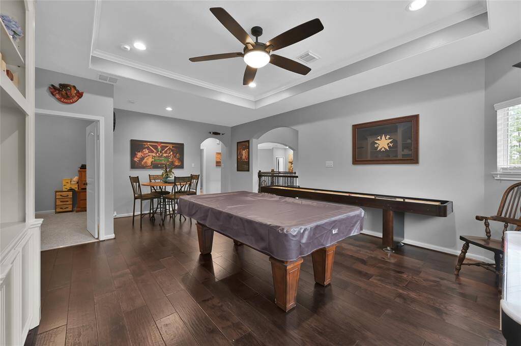 Pool table and shuffle board.  Secret room located near game room