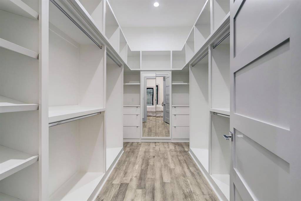 Walk-in closet in primary bedroom.