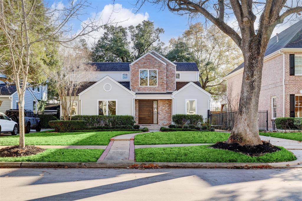 Two large trees frame the home so perfectly.  The landscaping was thoughtfully designed by Moss Landscaping to be low maintenance and look great throughout the year and includes a sprinkler system.