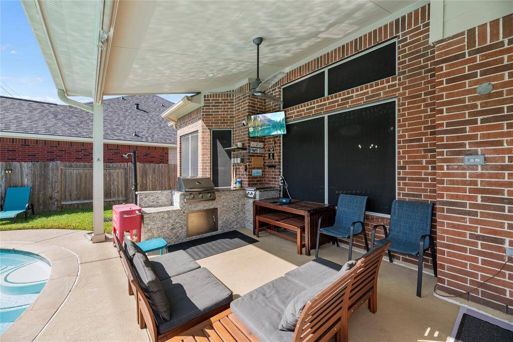 Back covered patio with outdoor kitchen