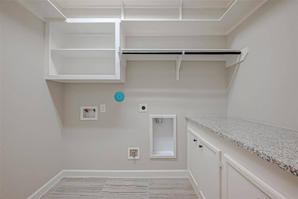 Laundry room with built ins.