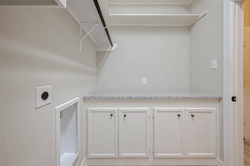 Another view of the folding zone in laundry and custom cabinetry too.