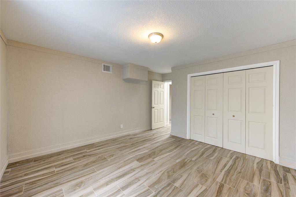 Another view of downstairs Bedroom Number 4 with durable tile flooring.