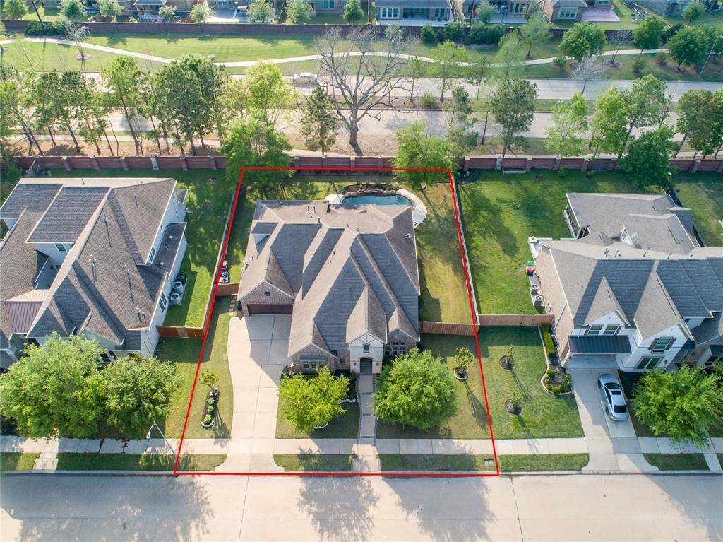Another aerial view showing Westmoor Drive behind the home