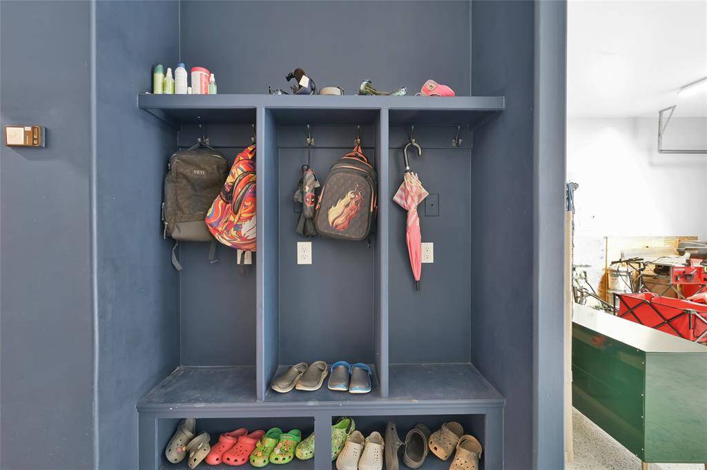 Mud room in garage next to house entrance