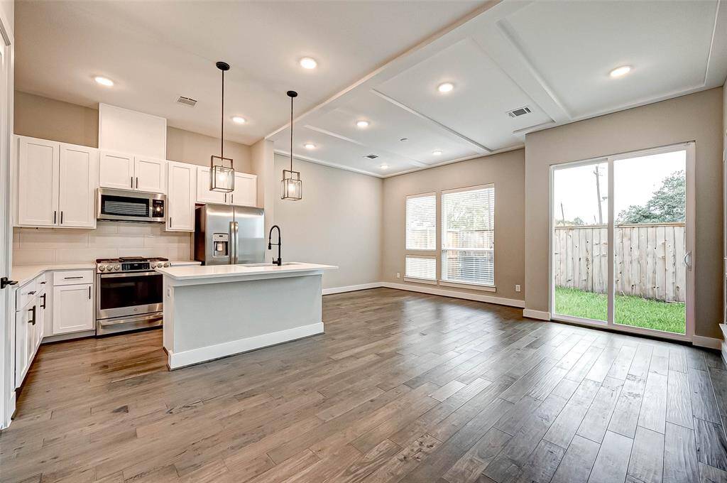 The home has wood floor and LED lighting throughout the first level.