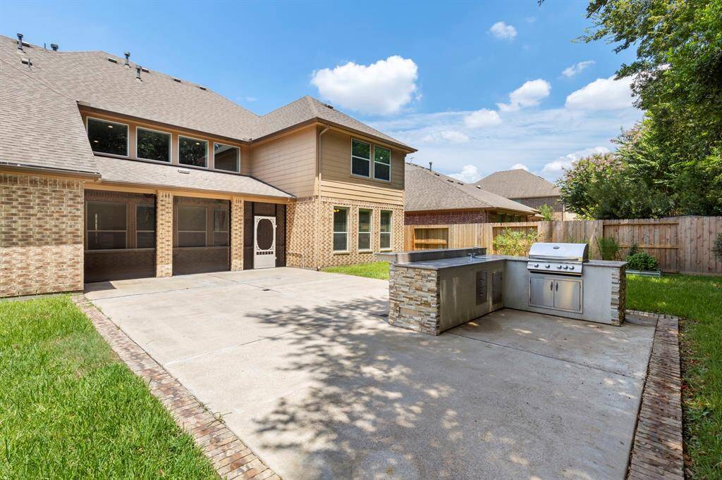 Extensive patio is great for entertaining and also the perfect spot for outdoor games.
