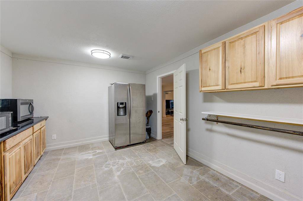 For laundry needs, it provides space for a washer and dryer, built-in storage, and a utility sink, making household chores convenient and streamlined. As a second kitchen, it boasts extra prep space, space for appliances, and room for a secondary fridge or freezer, perfect for catering, entertaining, or multi-generational living.