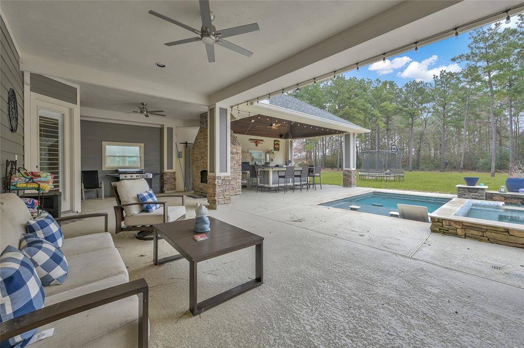 Covered patio opens up to pool/spa/outdoor kitchen area