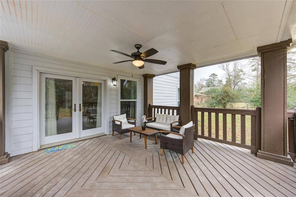 This view of the covered patio shows how incredibly spacious this patio is, located just off the downstairs liiving room. You may sit, and relax admiring the exquisite back yard and lsitending to all that nature has to allow!
