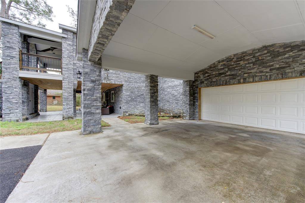 Stepping onto the property, you're greeted by an expansive two-car garage and an attached two-car portico, ensuring ample space for your vehicles and storage needs.
