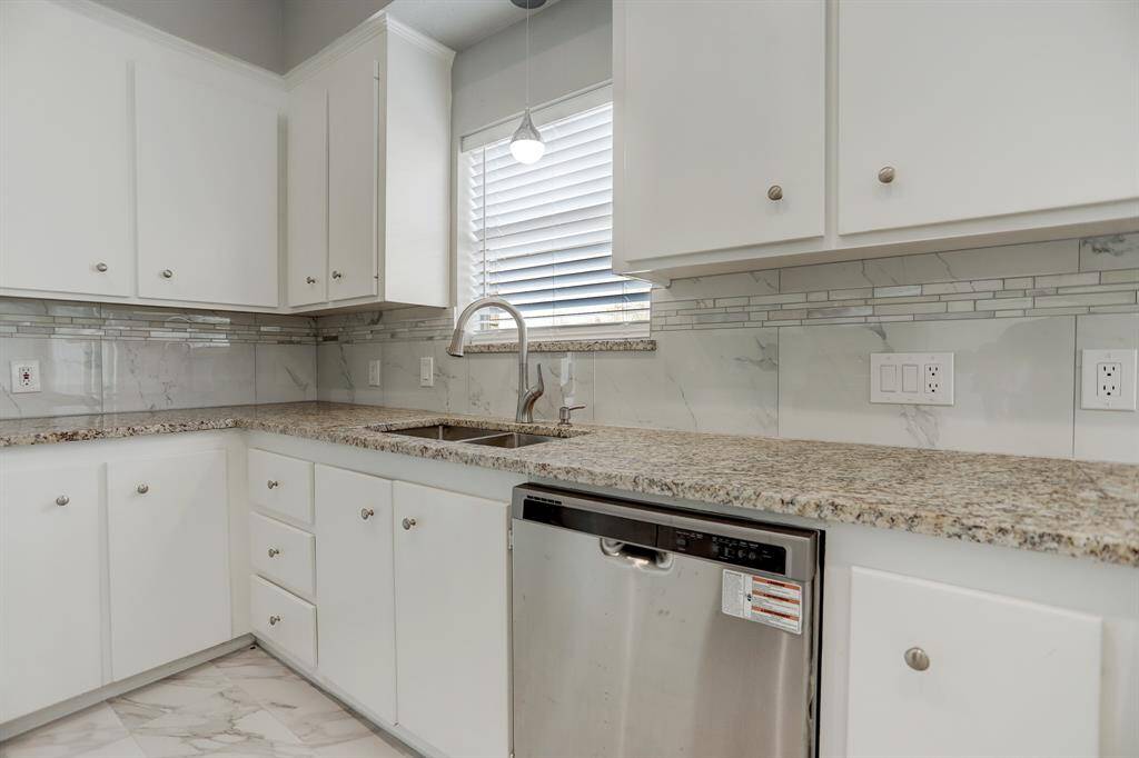 Granite freshly chosen for you. Stainless dishwasher and sink and tons of counter space for meal prep