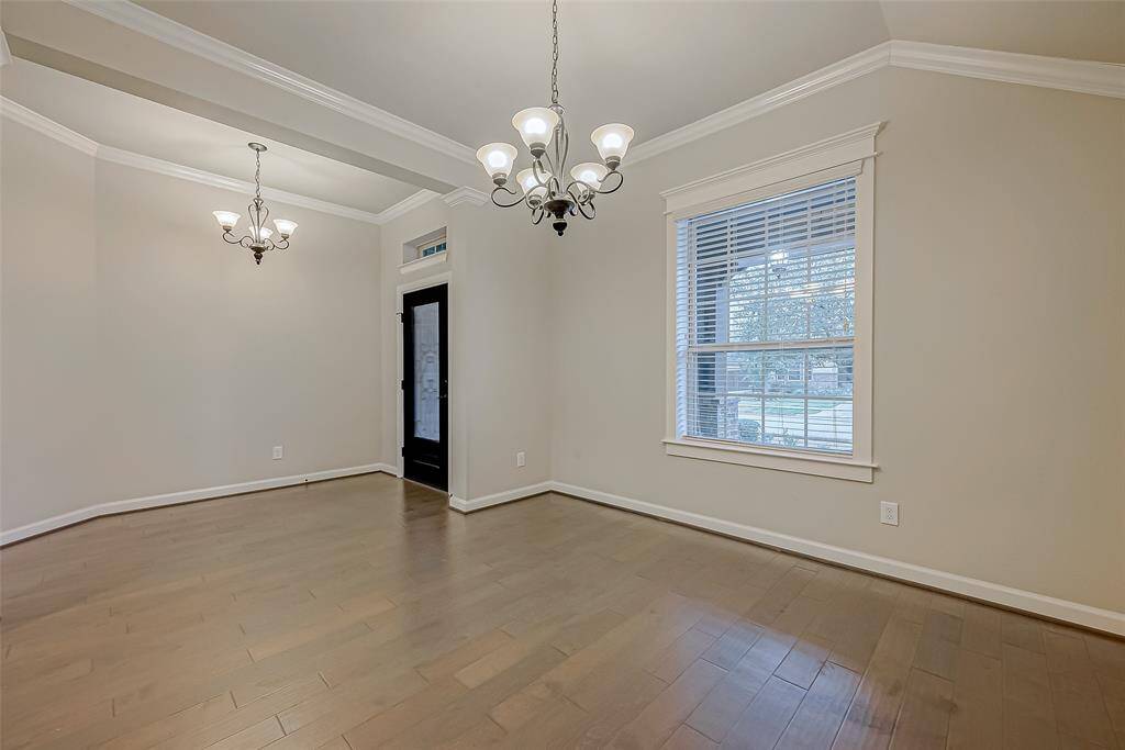 Study/Formal living is just off the entry! Neutral walls, crown molding and chandelier add a touch of elegance!