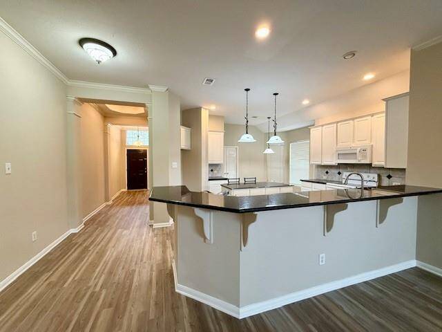 Family room opens up to Kitchen (multiple views)