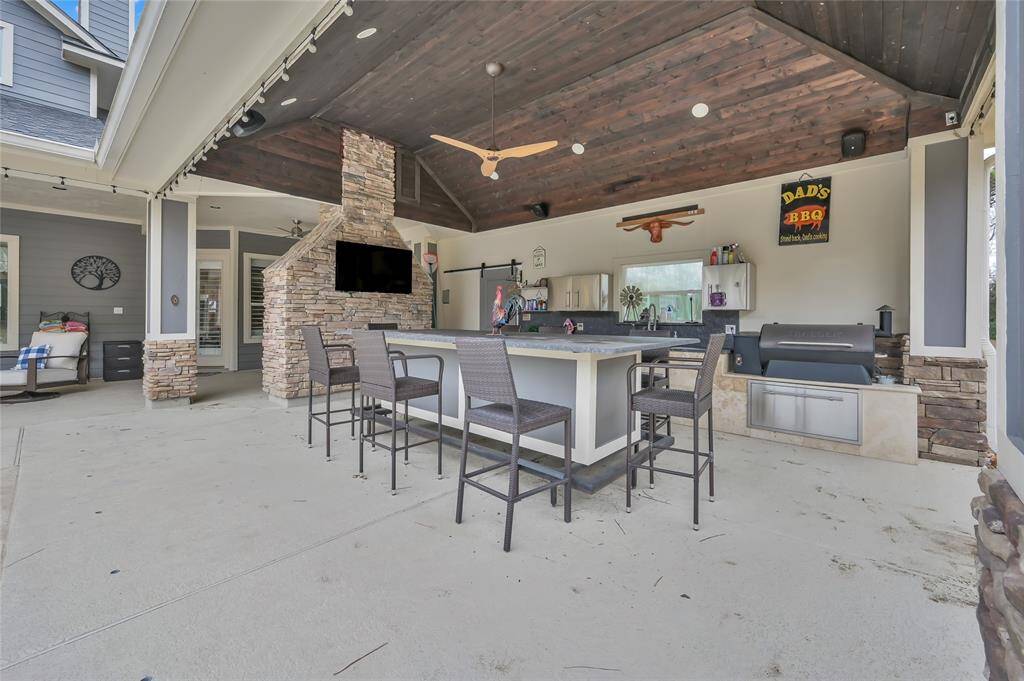 Outdoor kitchen w/ Blaze grill, pellet grill, and blackstone grill