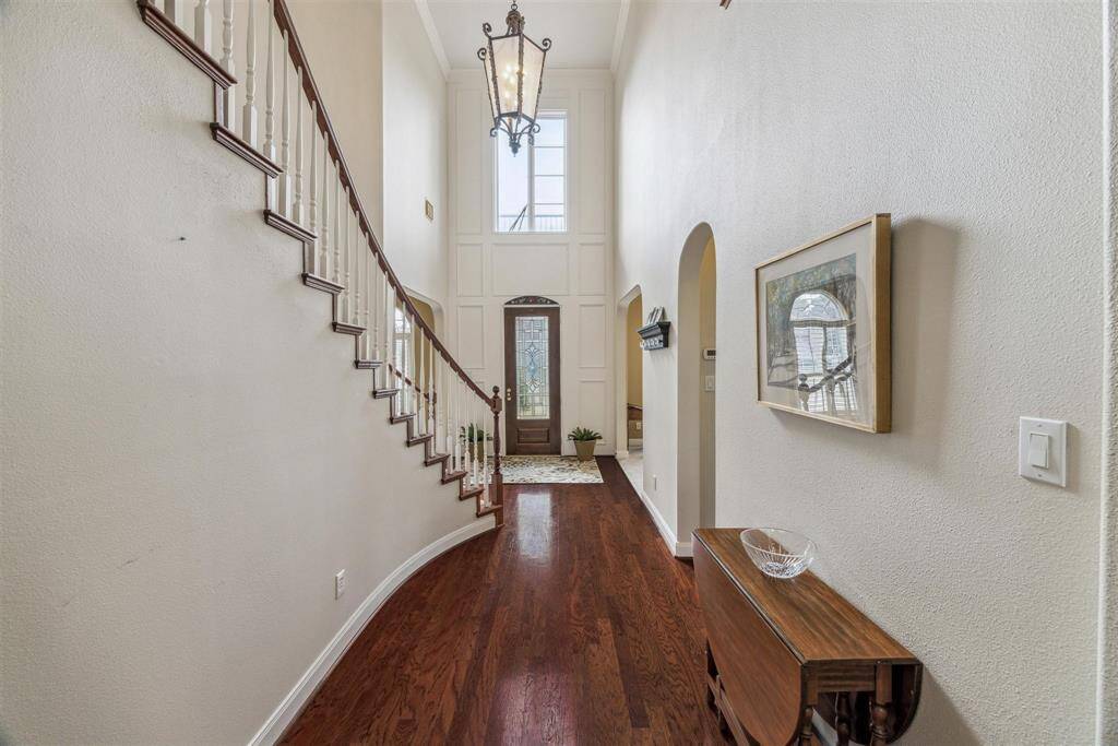 VIEW LOOKING DOWN THE FOYER TOWARD THE ENTRY DOOR - note the 2-story ceiling height in the foyer