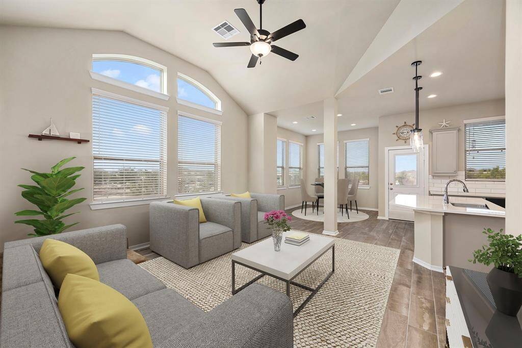 Expansive living room connects directly to the dining area and upscale kitchen.