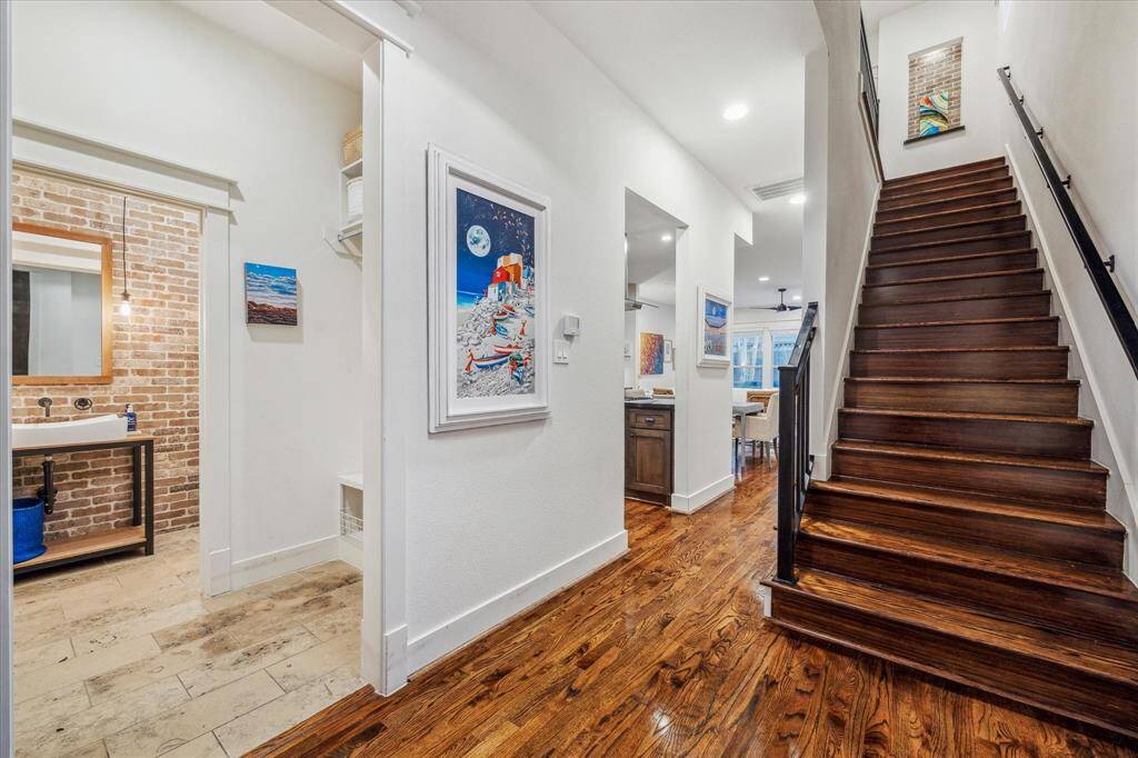 Entry: 2015 Builder's model home boasts meticulous attention to it’s upgraded integrity. Soaring ceilings, custom wrought iron banister, solid Walnut stairs with recessed stair lighting add grandeur to this unique space.