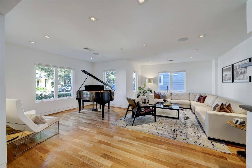 The Formal Living Room is a spacious, versatile space and with all the natural light, the perfect backdrop for art or living.