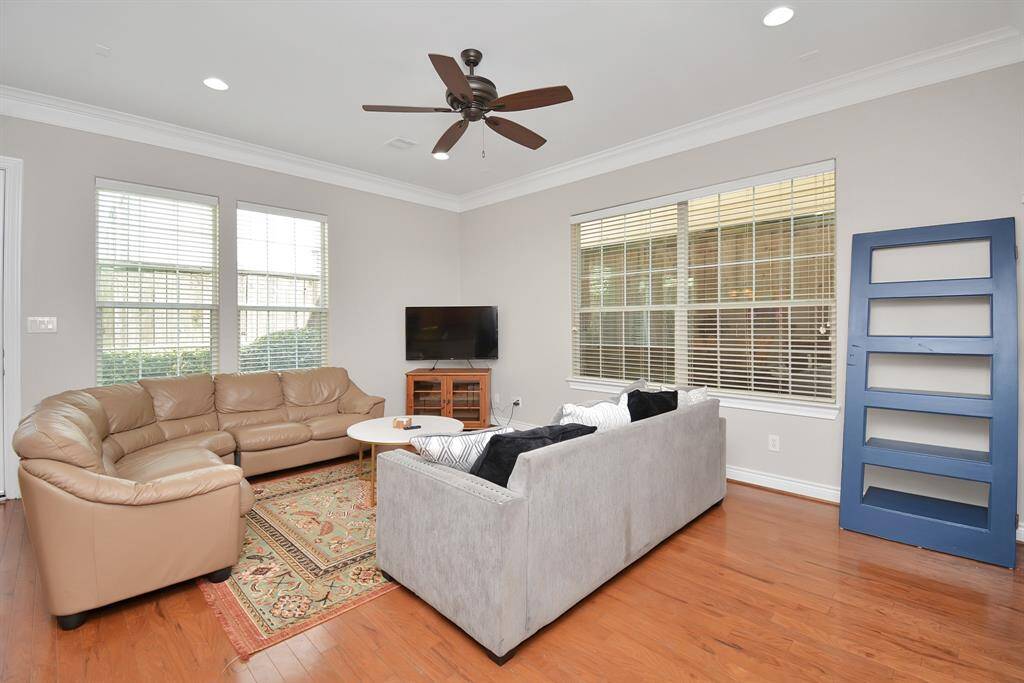 huge living area with plenty of natural light and large windows on the 1st floor