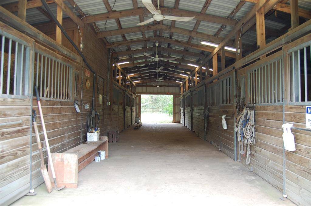 9 Stall horse barn, water, electricity and fans.