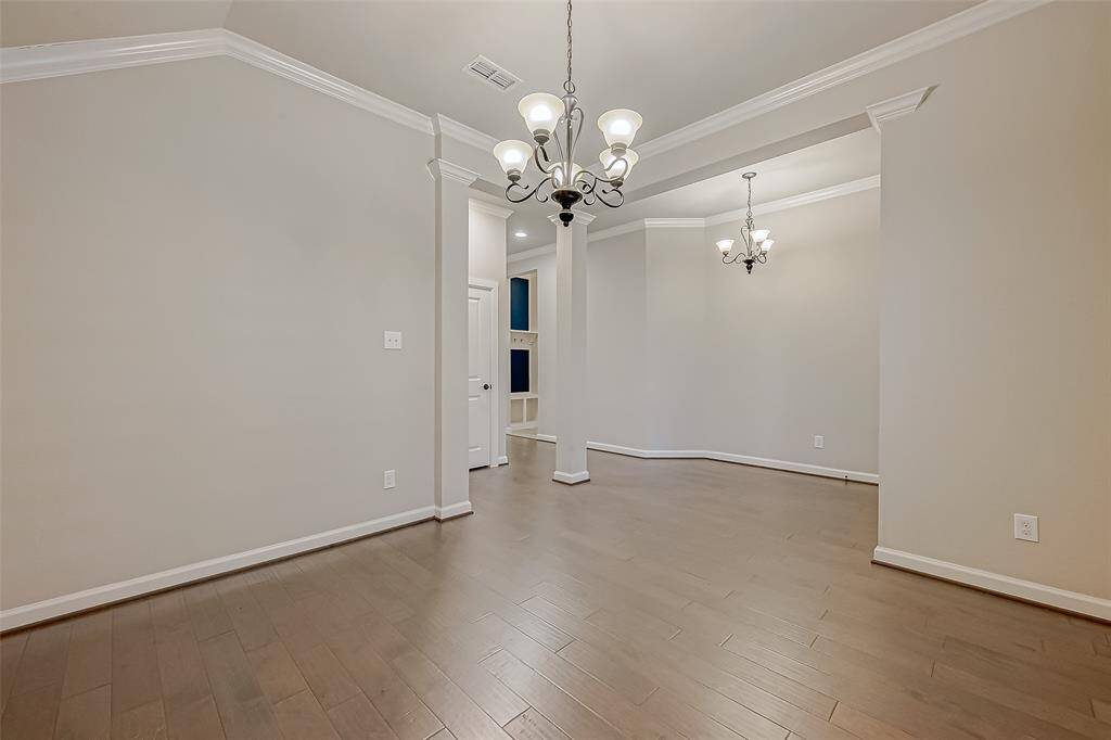 This space is open to the front hallway and also has a huge storage closet and 1/2 bath adjacent.