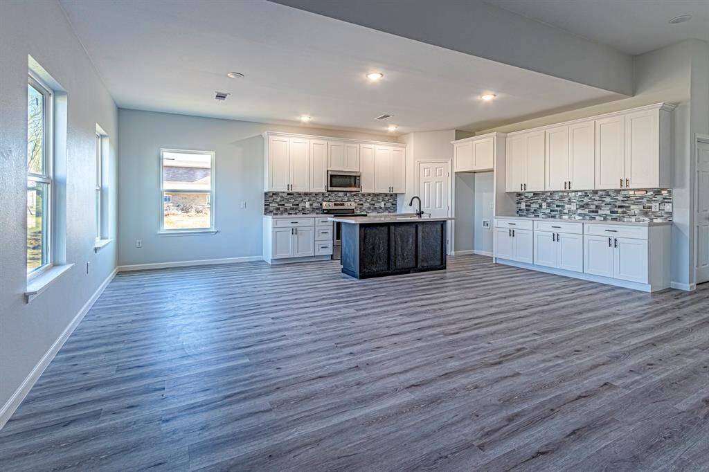 Is this open concept enough for you? Looking from the back door into the living/kitchen areas.