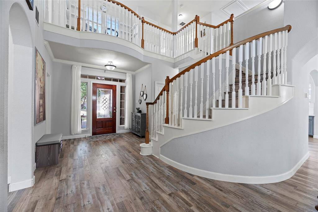 Front foyer with high ceilings and crown moldings