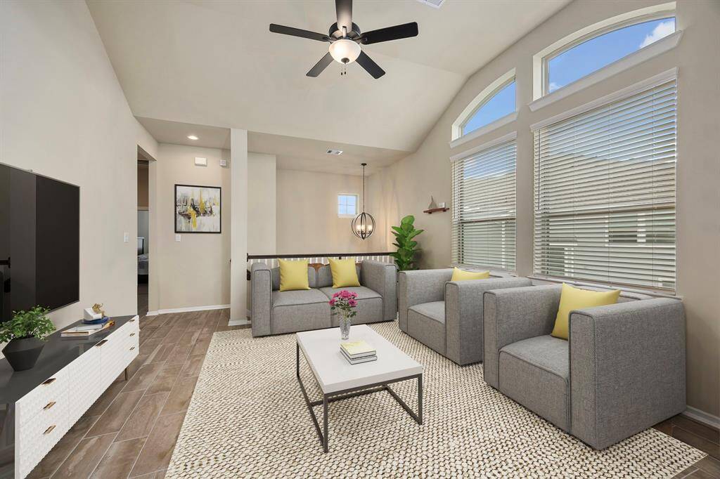 Expansive living room connects directly to the dining area and upscale kitchen.