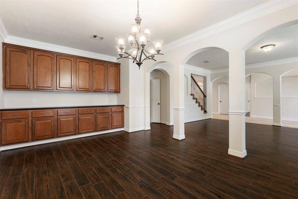 Don't miss the wall of built-ins and easy kitchen access from both the dining room and living room.