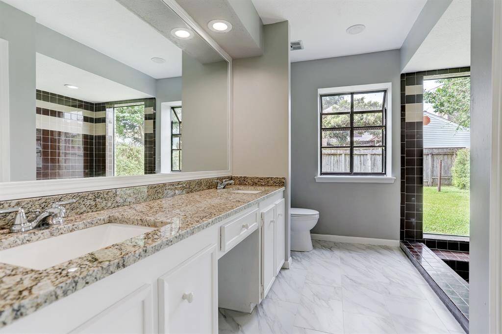 Primary Bathroom that is Light and Bright and recently updated.  Double sinks, sunken tub and a vanity area