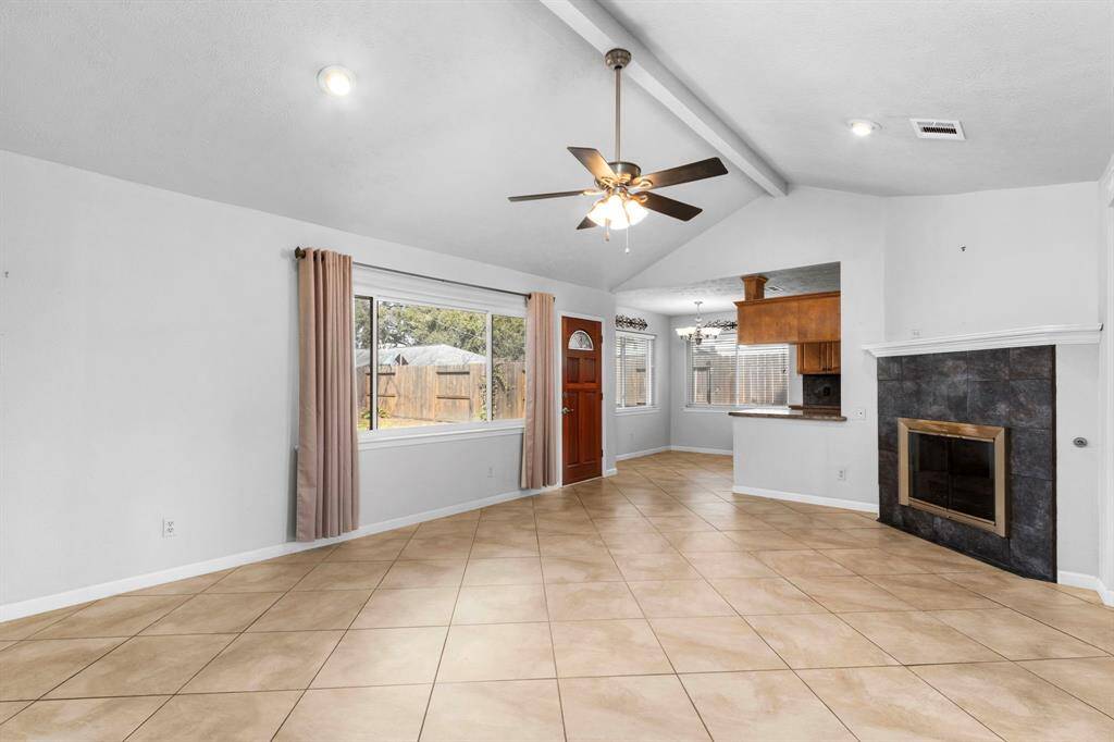 Open flow living to dining to walk through kitchen to breakfast with serving counter to living. Storm door behind exit door and storm door has a little doggie door for you pet. Window treatment is drapes in living and 2" blinds in breakfast area.