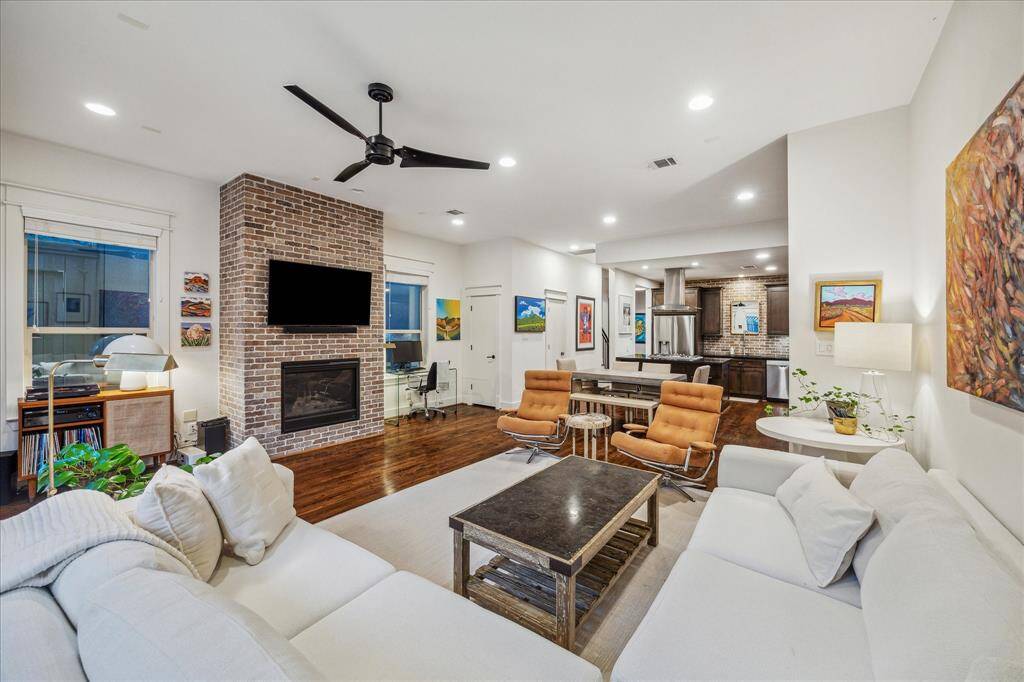Living Room: Immaculately constructed and designed in 2015, finished with the utmost quality and workmanship. The exotically modern Living Room's beauty is complemented by over-sized windows, art lighting, and rich hardwood floors.