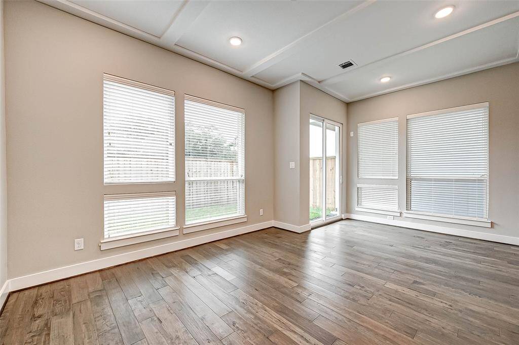 The 11x18 SF living room has a sliding glass door with access to the backyard.  Two inch blinds on windows throughout house.