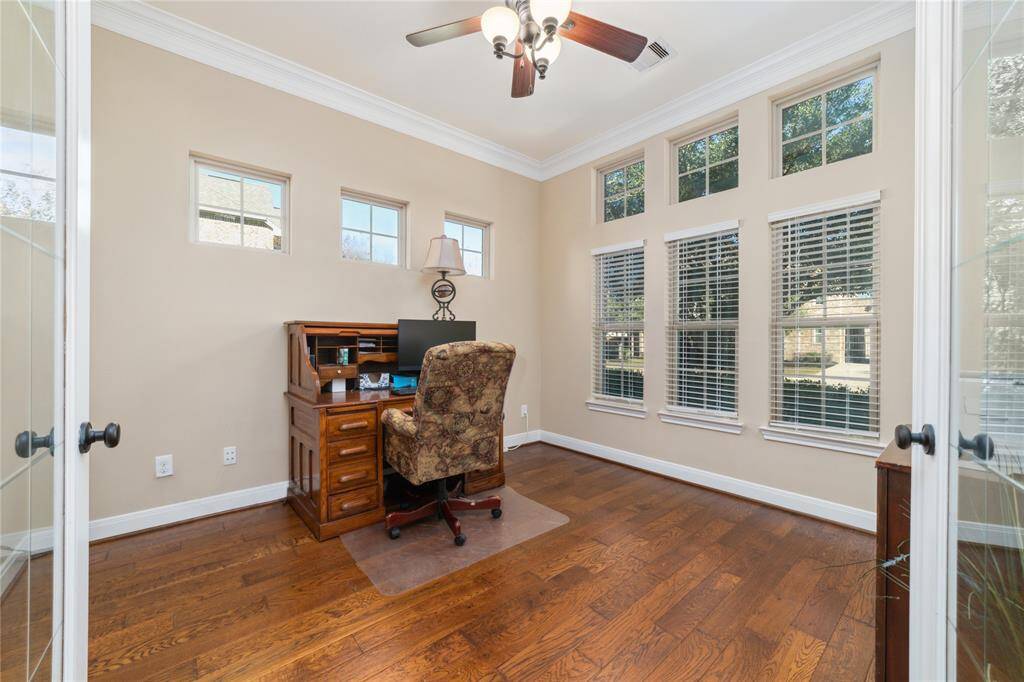 Home office located at the front of the home with plenty of natural light