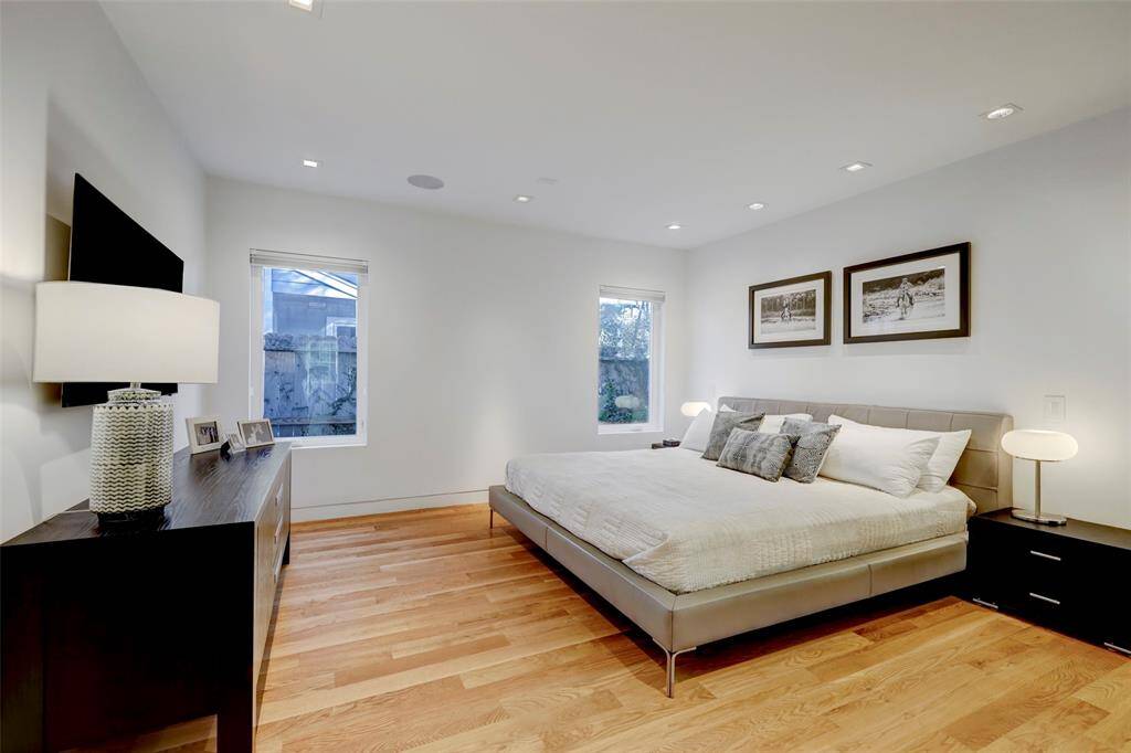 The primary bedroom is conveniently located on the first floor and offers his-and-hers closets.