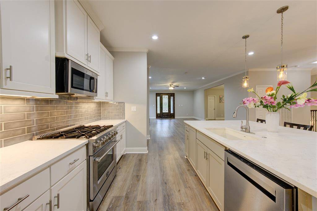 The sophisticated, top-notch stainless steel appliances elevate this gourmet kitchen to a whole new level of sophistication and functionality.